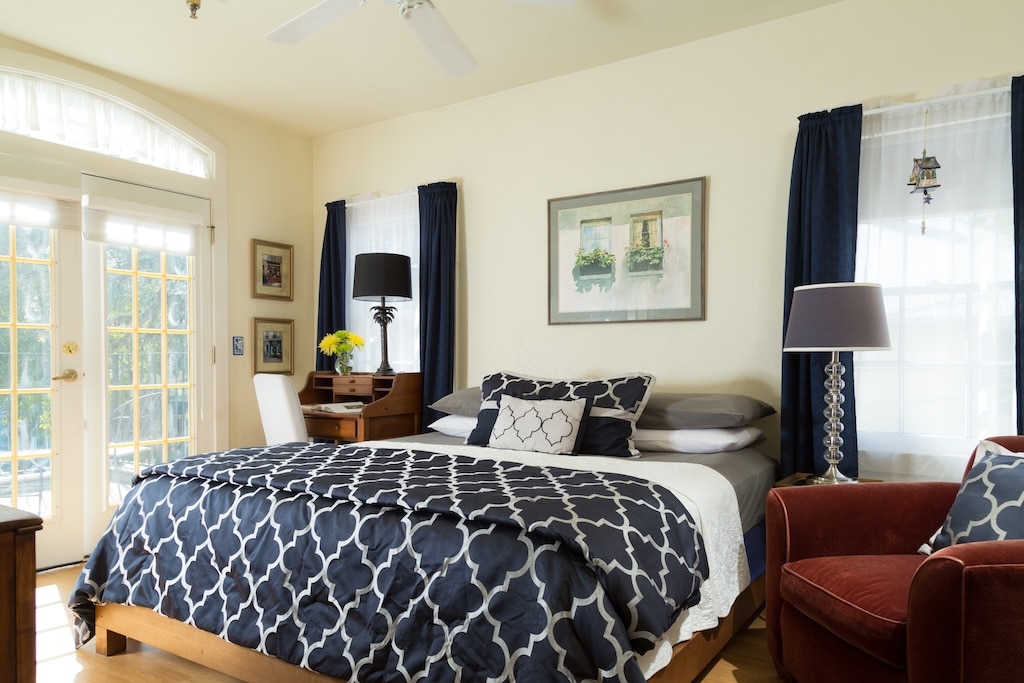 The Top 10 St. Augustine Restaurants 2 Stay at the best Bed and Breakfast in St. Augustine, FL after enjoying St. Augustine restaurants. Here is a thoughtful king sized bed with a navy and white comforter.