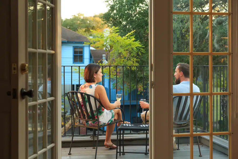 Breweries in St. Augustine, couple enjoying a drink on a private deck