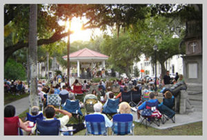 People enjoying the music in the Plaza